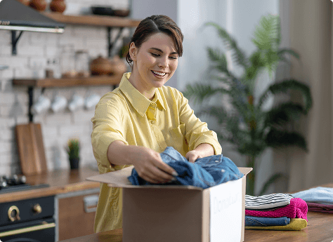 A customer unpacking clean, folded clothes